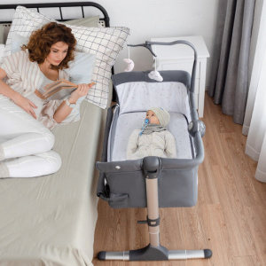 Height Adjustable Bassinet Bedside Crib with Music Box and Toys for Babies