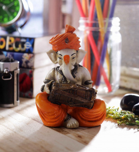 Lord Ganesha playing Dholak